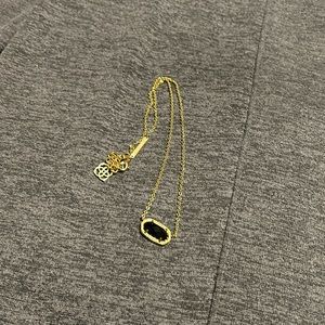 Kendra Scott black/gold necklace.